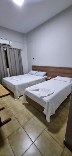 Ein Bett oder Betten in einem Zimmer der Unterkunft Hotel Brivanna