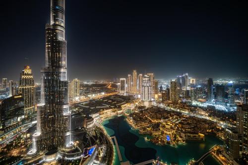 Luxury Apartments at Grande with Burj Khalifa & Fountain View Walk to Dubai Mall, Private Cinema
