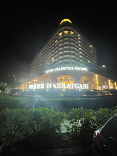 a large building at night with lights on it at Regal StayThe Perfect Blend of Luxury And Comfort in Nilmatha