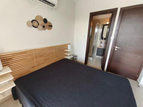 Ένα ή περισσότερα κρεβάτια σε δωμάτιο στο Harmonia Home