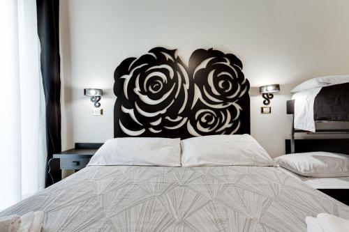 Ένα ή περισσότερα κρεβάτια σε δωμάτιο στο Hotel Le Cinéma