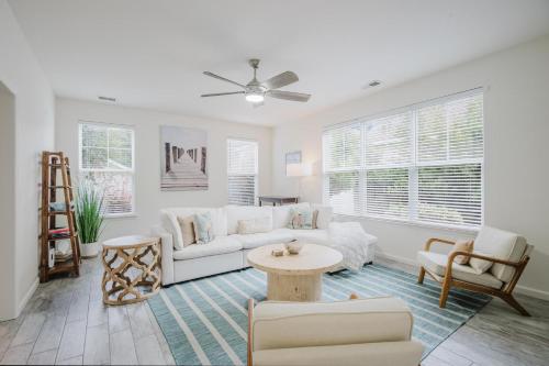a living room with a white couch and a table at Happy in Old Town Bluffton in Bluffton