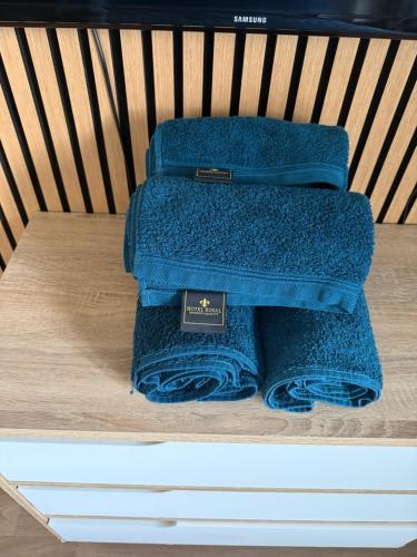 two blue towels sitting on top of a bench at Villeurbanne la soie - Rhône express in Villeurbanne