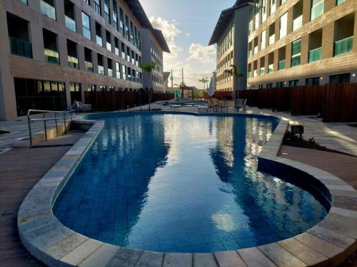 Bazén v ubytování Flat de Luxo- Jacuzzi Privativa a 300m da praia! nebo v jeho okolí