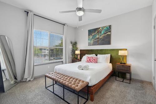 a bedroom with a large bed and a window at Furnished apartments next to the Domain in Austin