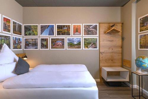 Postel nebo postele na pokoji v ubytování Boutique Hotel Zum grünen Baum