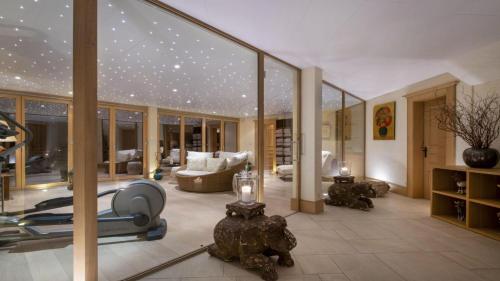 a living room with a gym with a lot of glass at Entrebin PremiumChalet AO in Aosta