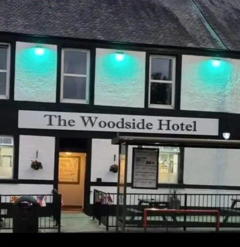 a building with a sign that reads the woodside hotel at The Woodside in Cowdenbeath