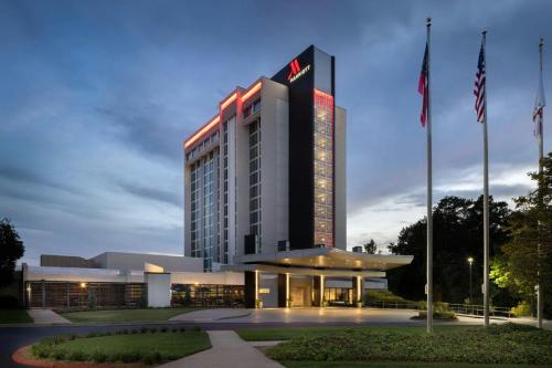 a building with a lit up sign on it at Atlanta Marriott Perimeter Center in Atlanta