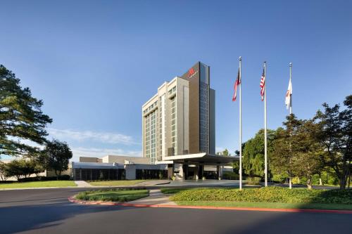a building with two american flags in front of it at Atlanta Marriott Perimeter Center in Atlanta