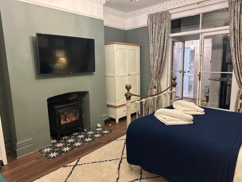 Ένα ή περισσότερα κρεβάτια σε δωμάτιο στο The Garden Flat