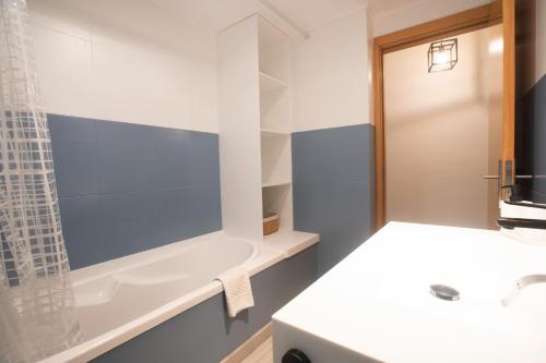 a bathroom with a sink and a shower at Porto Panorama by Sira Stays in Porto