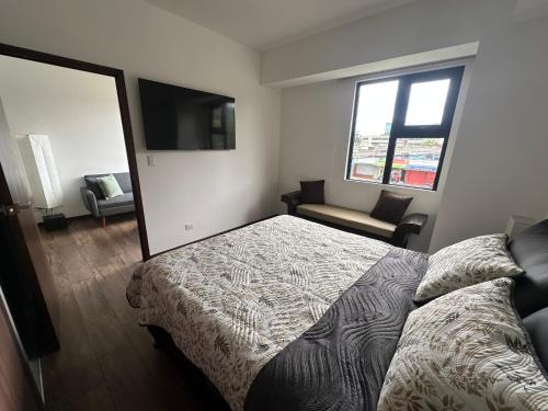 Postel nebo postele na pokoji v ubytování Apartment in zone 10 with Pool & Gym