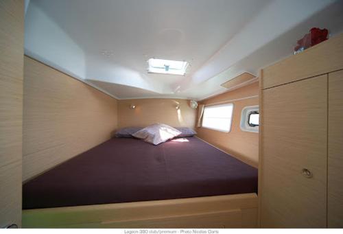 a small room with a bed in the middle at Catamaran Jaso in Jadranovo