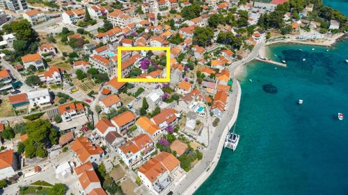 an aerial view of a town next to the water at Award winning Garden Apartment with large Terrace and amazing Seaview in Bol