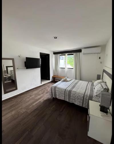 Ένα ή περισσότερα κρεβάτια σε δωμάτιο στο Departamentos Naa'y