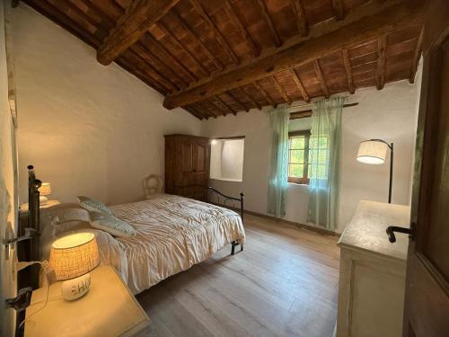 Postel nebo postele na pokoji v ubytování La Fornace di Tremoleto