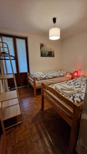 a room with two bunk beds and a ladder at Il Bucaneve in Mollia