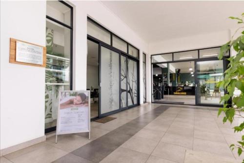 a building with a sign in the middle of a hallway at Apartment at the Blyde in Pretoria
