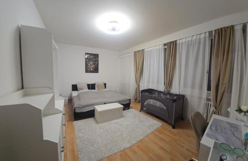 Una cama o camas en una habitación de LaCasa-Mia Apartment Basel