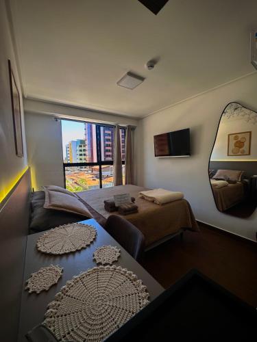 Postel nebo postele na pokoji v ubytování Flat moderno - 300m da praia