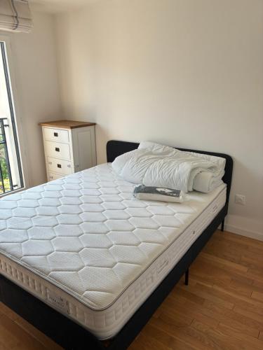 En eller flere senge i et værelse på Carré Haussmann avec parking