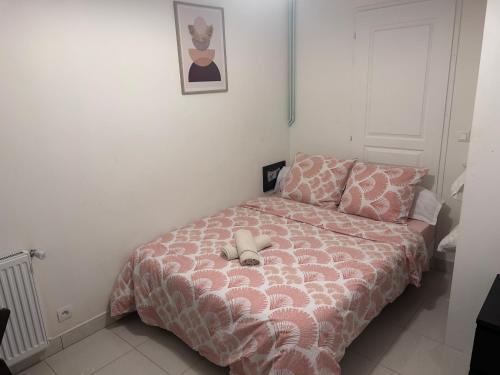 Ένα ή περισσότερα κρεβάτια σε δωμάτιο στο Séjour magique entre Paris et Disney