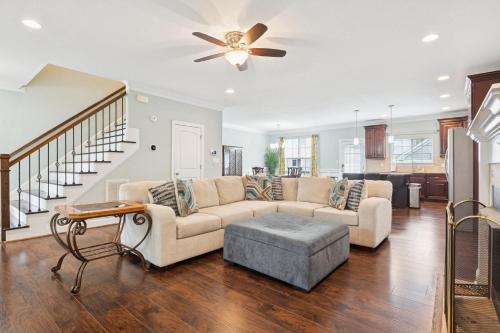 a living room with a couch and a ceiling fan at Sojourn Beautiful Family Home with Backyard in Ghent in Norfolk