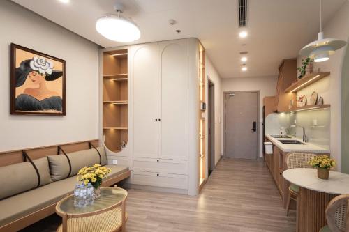 a dressing room with a bench and a table at La Vie Eco in HÆ°ng YÃªn