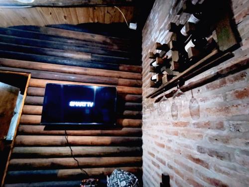 a stage with a sign on a brick wall at casa quinta los teritos in Abasto