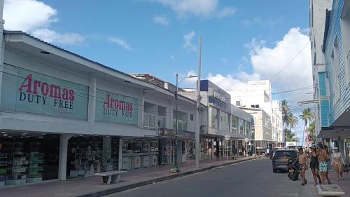 a city street with people walking down the street at Hostal San Andres Vive in San Andrés