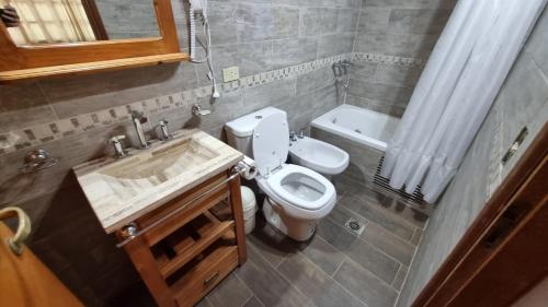 Koupelna v ubytování Complejo con piscina Cubierta