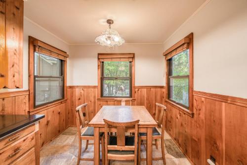 a dining room with a wooden table and chairs at Diana's Cabin by Tahoe Getaways - Pet-Friendly 2BR in Kings Beach w Backyard & Walk to Lake! in Wood Vista