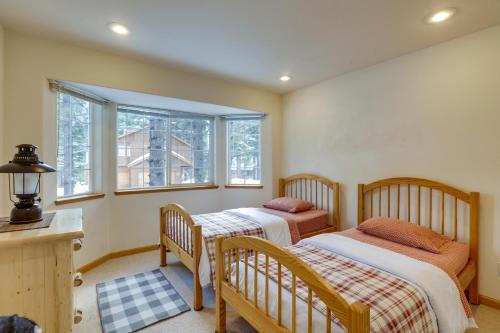 two beds in a room with two windows at 7 Mi to Northstar Resort Tahoe Vista Family Cabin in Tahoe Vista