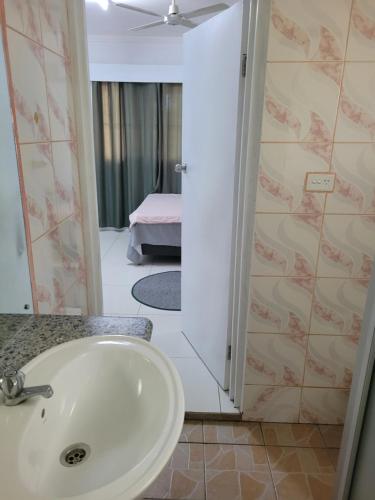 a bathroom with a sink and a shower at Shalom Home Stay in Nadi International Airport