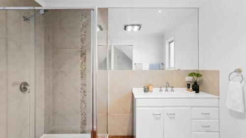 a bathroom with a shower and a sink at 2 Marma Retreat - Peaceful Surrounds with Heated Pool & Spa in Red Hill