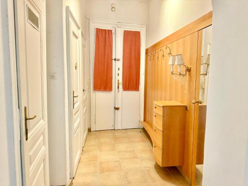 a room with a hallway with a dresser and a door at Spacious Classical Style Apartment in Vienna
