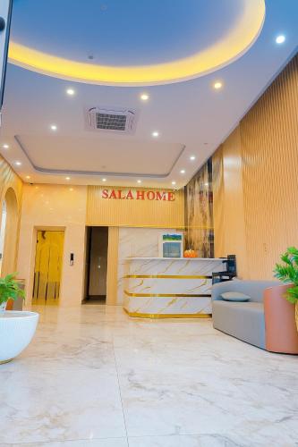a lobby of a mall with a sign on the ceiling at Sala Home Móng Cái in Móng Cái