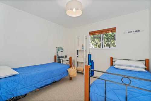 Postel nebo postele na pokoji v ubytování MCKE129 - Classic Kiwi Bach Escape