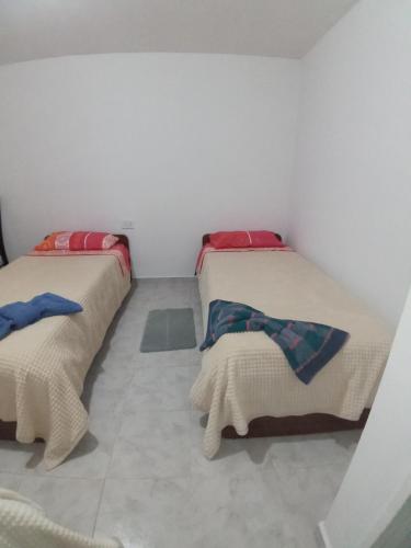 Postel nebo postele na pokoji v ubytování Casa Adelaida