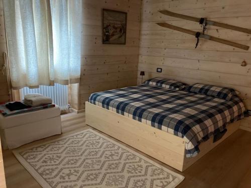 Postel nebo postele na pokoji v ubytování Dolomite Nest