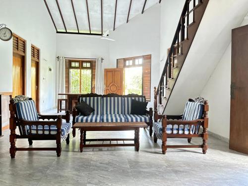 a living room with a couch and two chairs at Calm Casita Luxury Villa in Matara in Matara