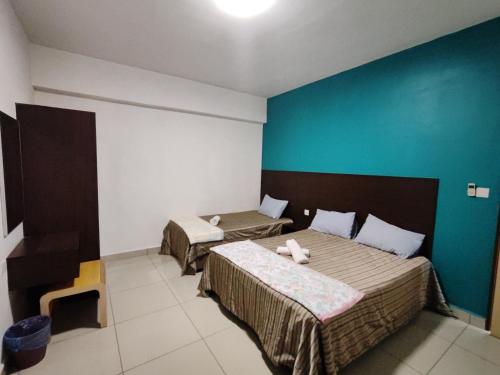 Postel nebo postele na pokoji v ubytování KIMNA HOME at MARINA HEIGHT