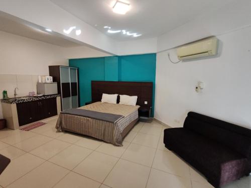 Postel nebo postele na pokoji v ubytování KIMNA HOME at MARINA HEIGHT