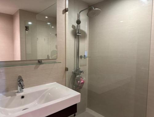 a bathroom with a white sink and a shower at Room in The Title Rawai Phase 1,2, Condo in Rawai, Room in Rawai, Room in The Title Rawai in Rawai Beach