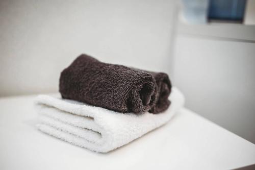 a towel sitting on top of a white counter at Holiday on Hamblyn - 2 BR home near Fitzroy Beach in New Plymouth