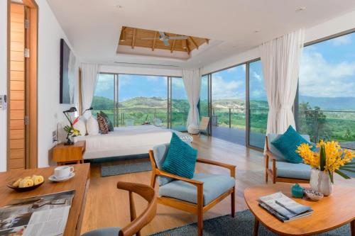 Ένα ή περισσότερα κρεβάτια σε δωμάτιο στο Tropical Castle Villa