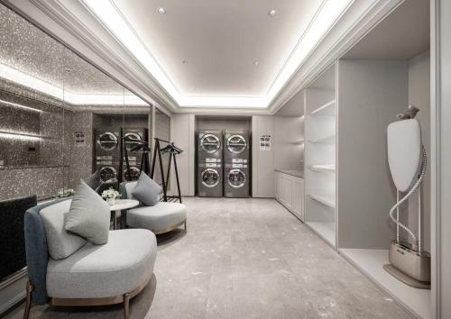 a dressing room with two chairs and a table at Mercure Lanzhou Dongfanghong Square Hotel in Lanzhou