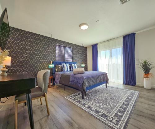 a bedroom with a bed and a desk and a piano at Forty First Place - Boutique Hostel in Los Angeles