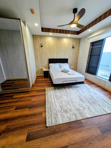 a bedroom with a bed and a large rug at ICHA Apartments in Suva
